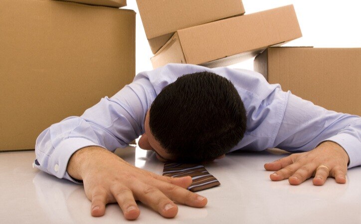 HubSpot-website-migration_Businessman-crushed-by-moving-boxes